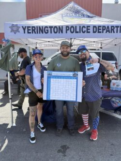 Ron Wells wins Night in the Country tickets in Yerington Police Department's raffle for K9 program.