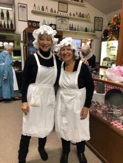 Lyon County Museum Board member, Cheryl Hayes and museum volunteer Janice Shipley have a little fun before the event.