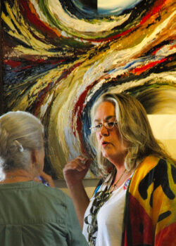 Artist Sherry Jennings with her painting. By Richard Massey.