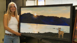 Artist Dixie Cornella with her painting. By Rich Massey.