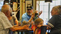 Discussing the Bighorn Crossing exhibits. By Richard Massey.
