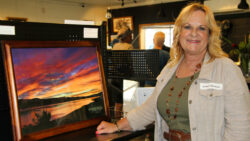 Kathy Trujillo with her Sunset at Walker Lake print. By Roberta Bryant.